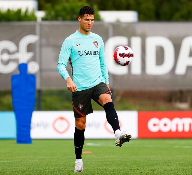 Cristiano Ronaldo wearing the uniform of the Portugal national football team while practicing in a stadium